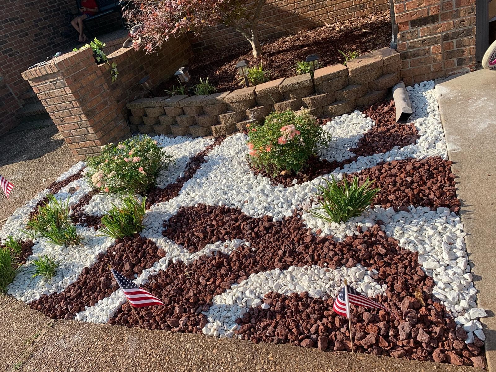 Rock garden with retaining wall and decorative stones